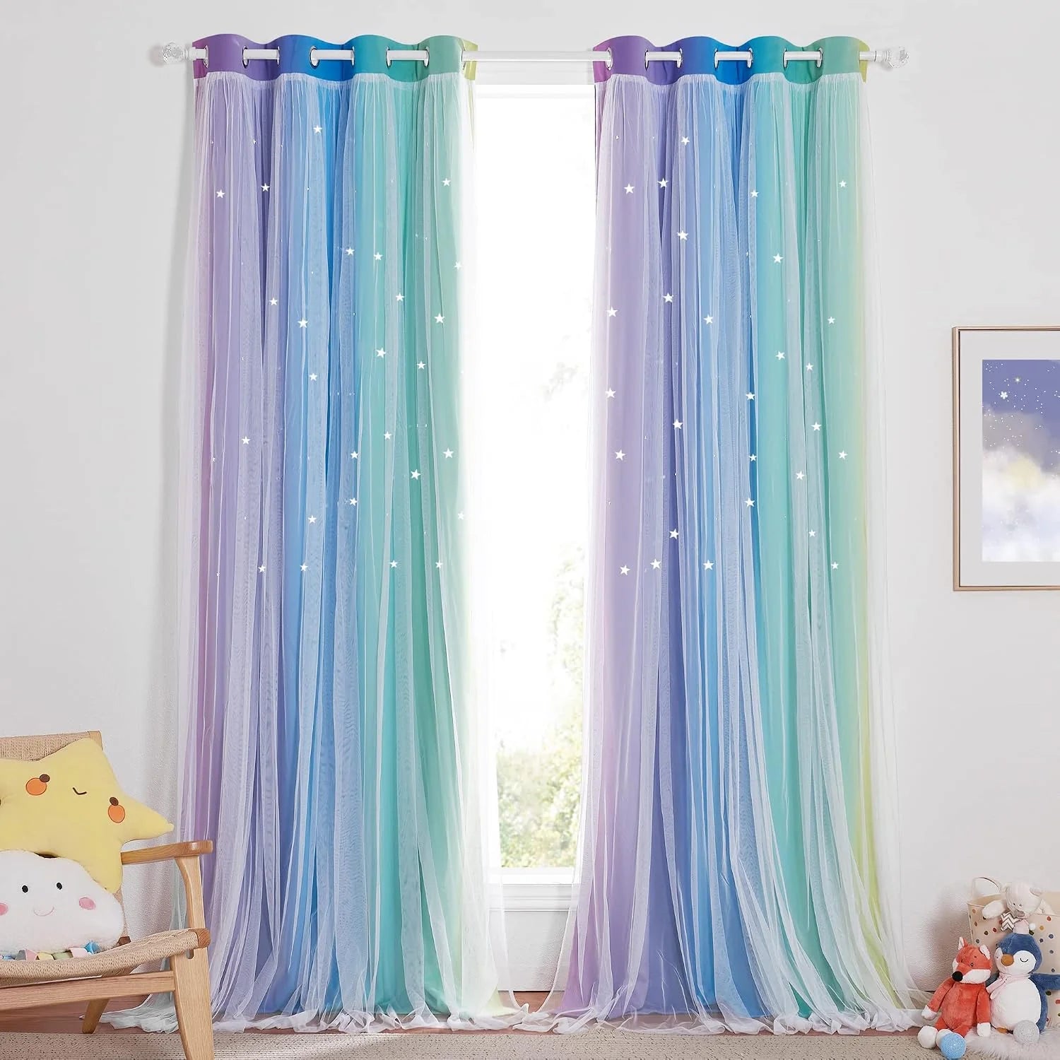 Pastel rainbow sheer curtains with star cutouts hanging in a bright kids bedroom