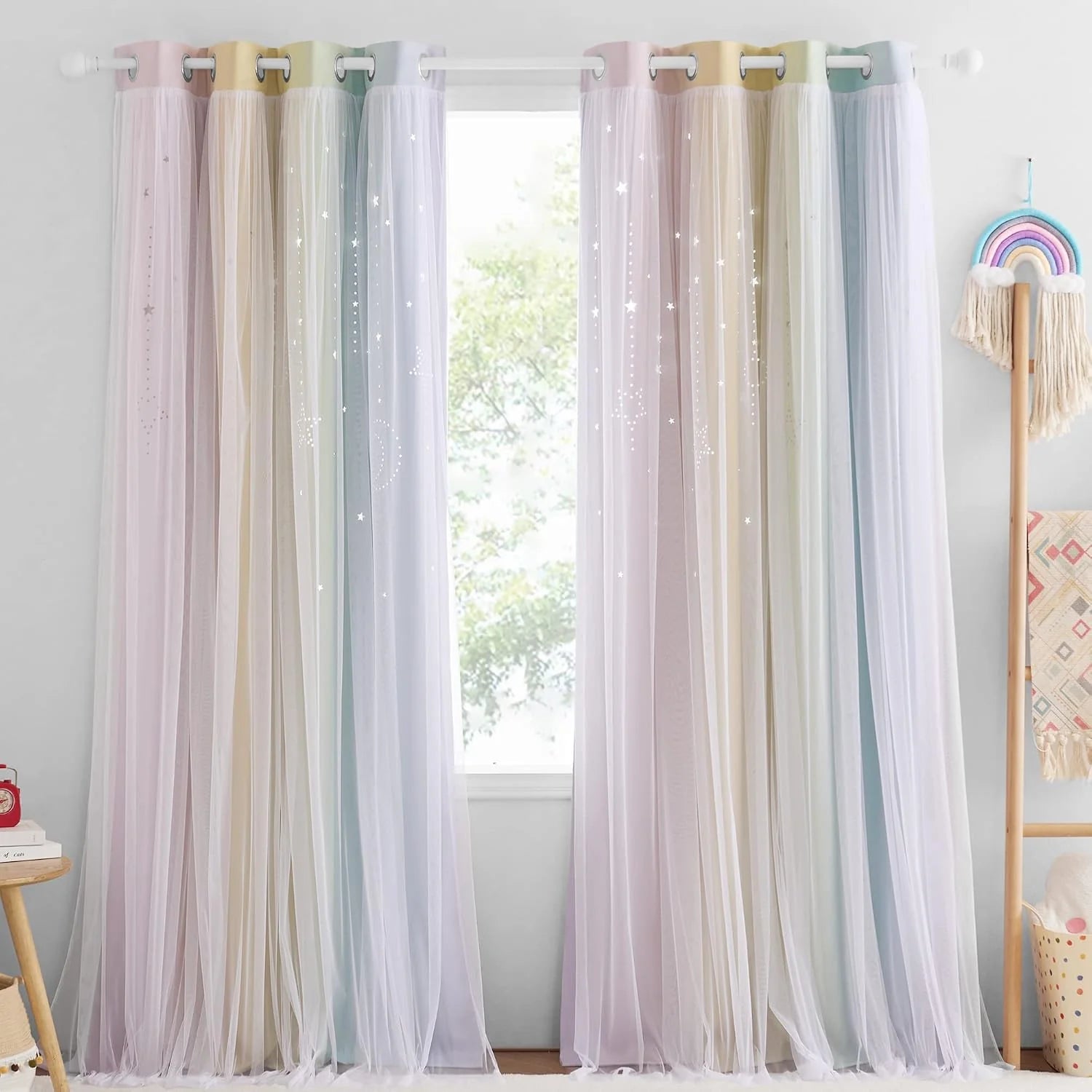 Pastel sheer rainbow curtains with star details and grommet top in a kids room