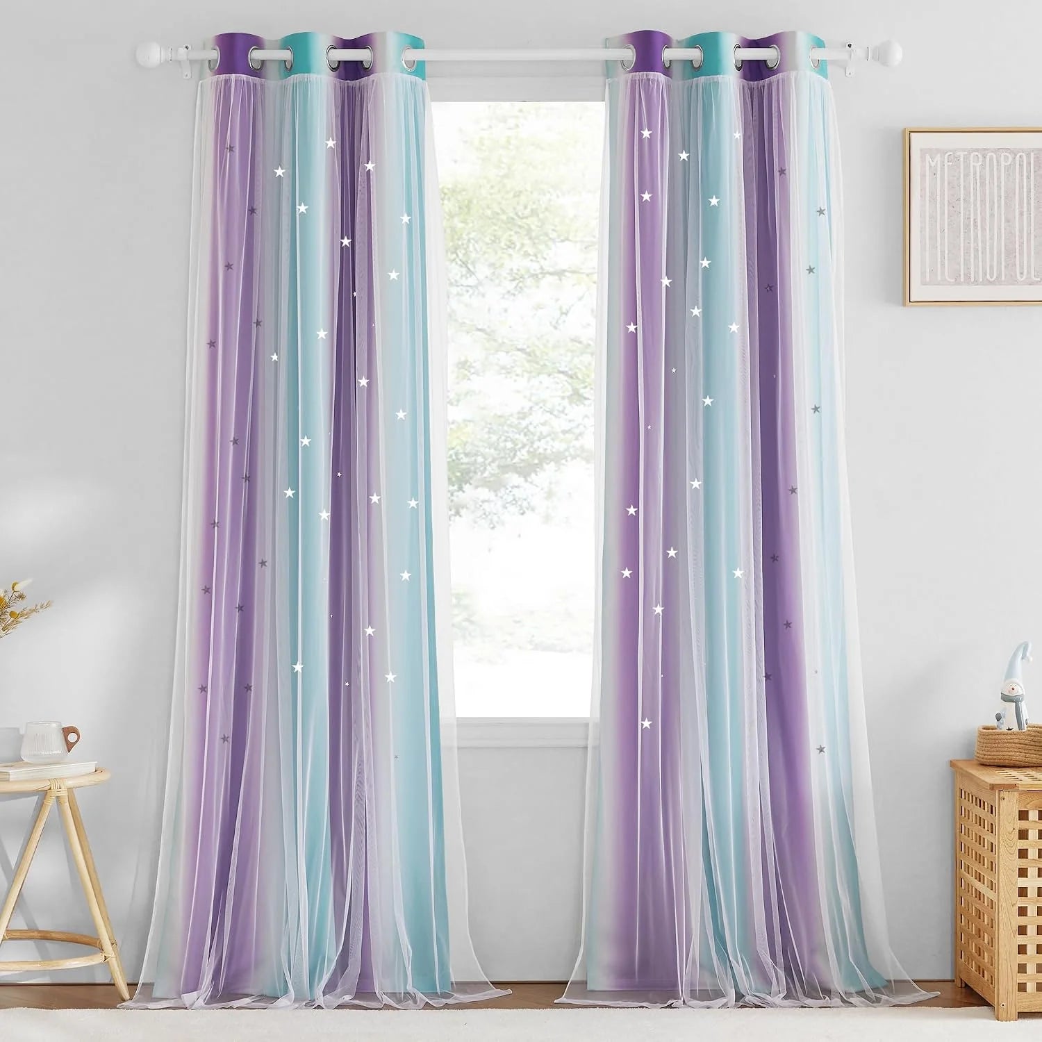 Pastel purple and blue sheer ombre curtains with star details on a white rod
