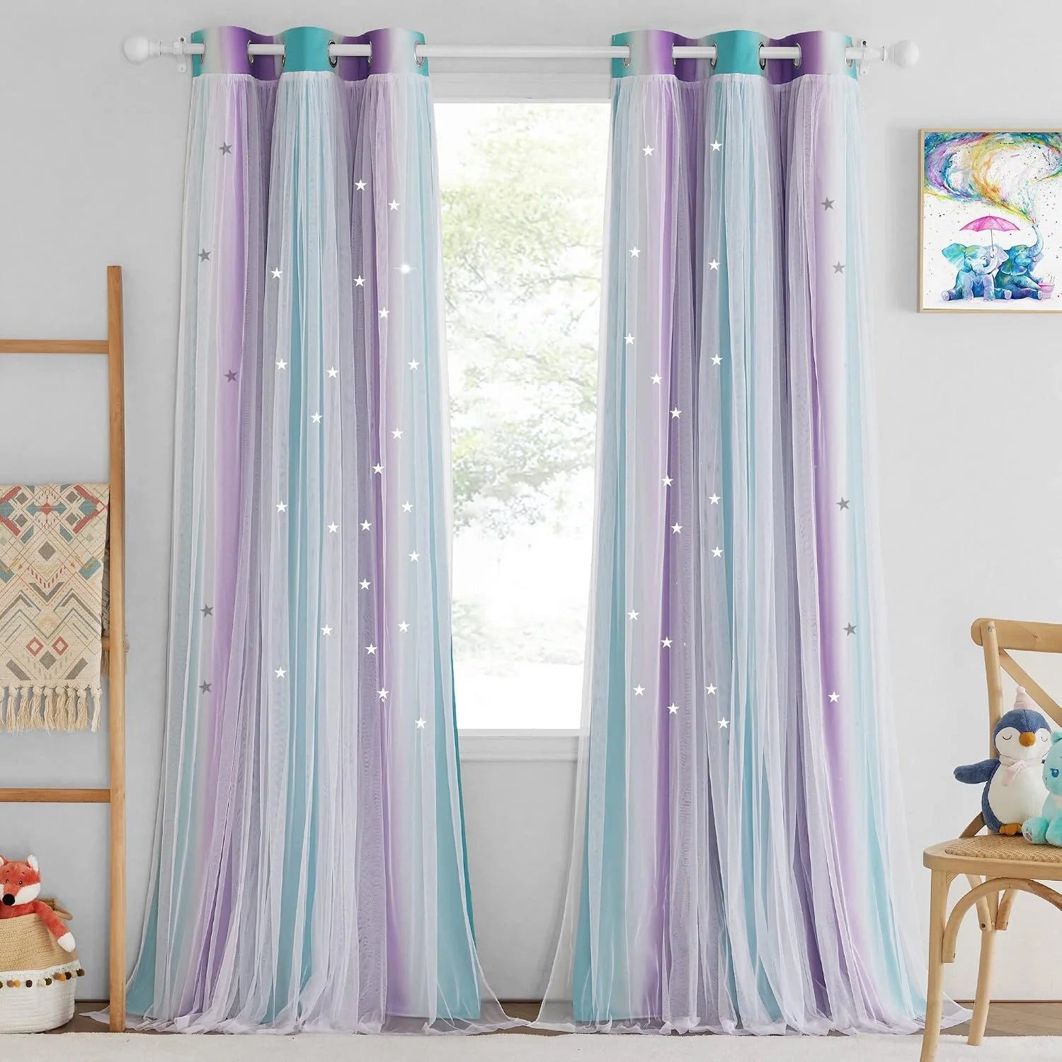 Pastel purple and blue sheer tulle curtains with star details in a kids room
