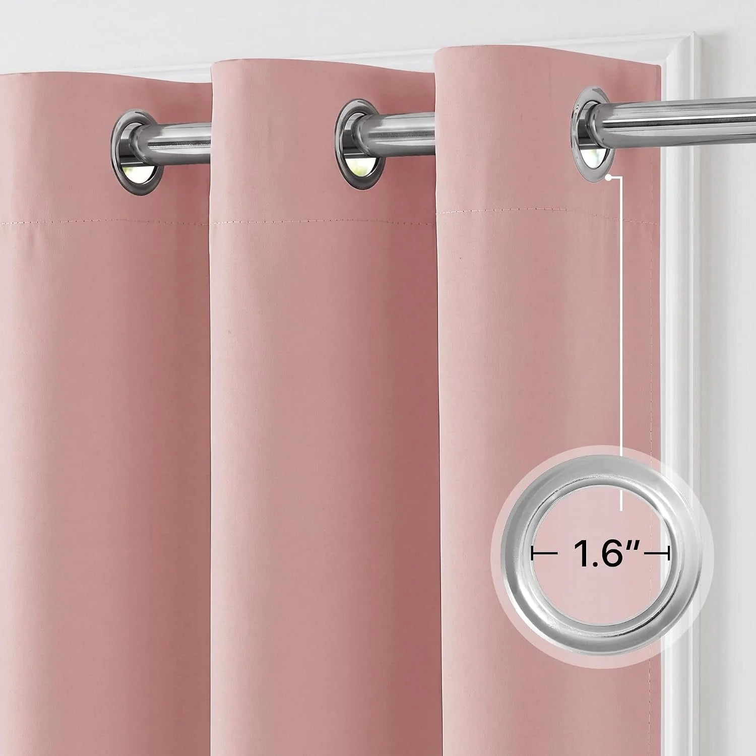 Close-up of a dusty pink grommet top curtain panel on a silver rod, showing a 1.6-inch grommet diameter.