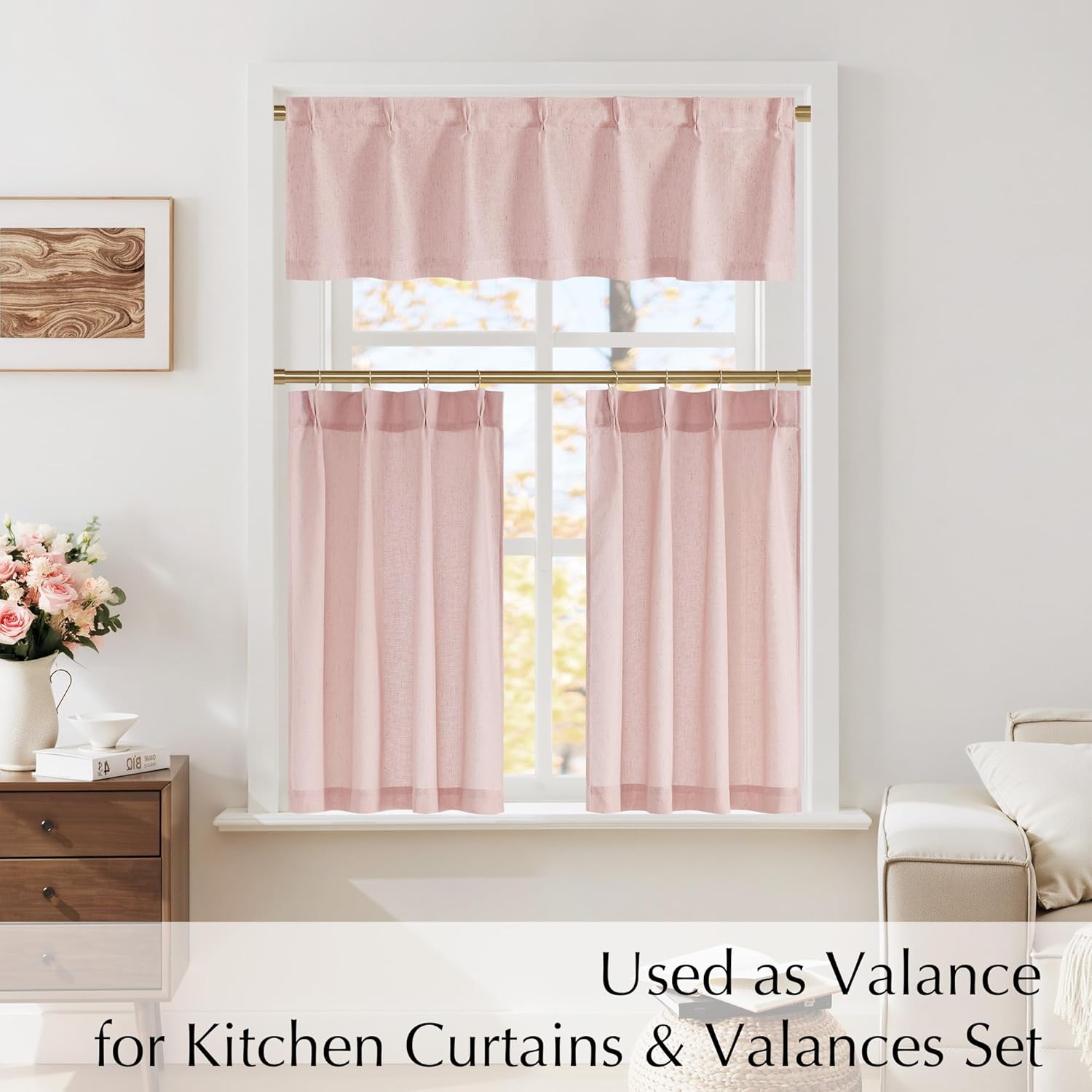 Light pink linen blend rod pocket cafe curtains and matching valance set on golden rods in a window.