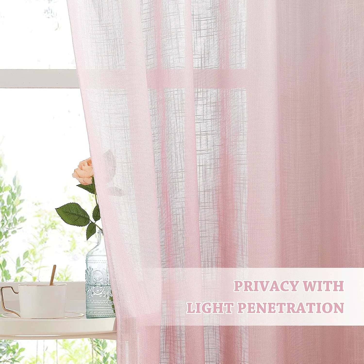 Soft pink sheer linen-look curtain filtering daylight by a window with cup and vase
