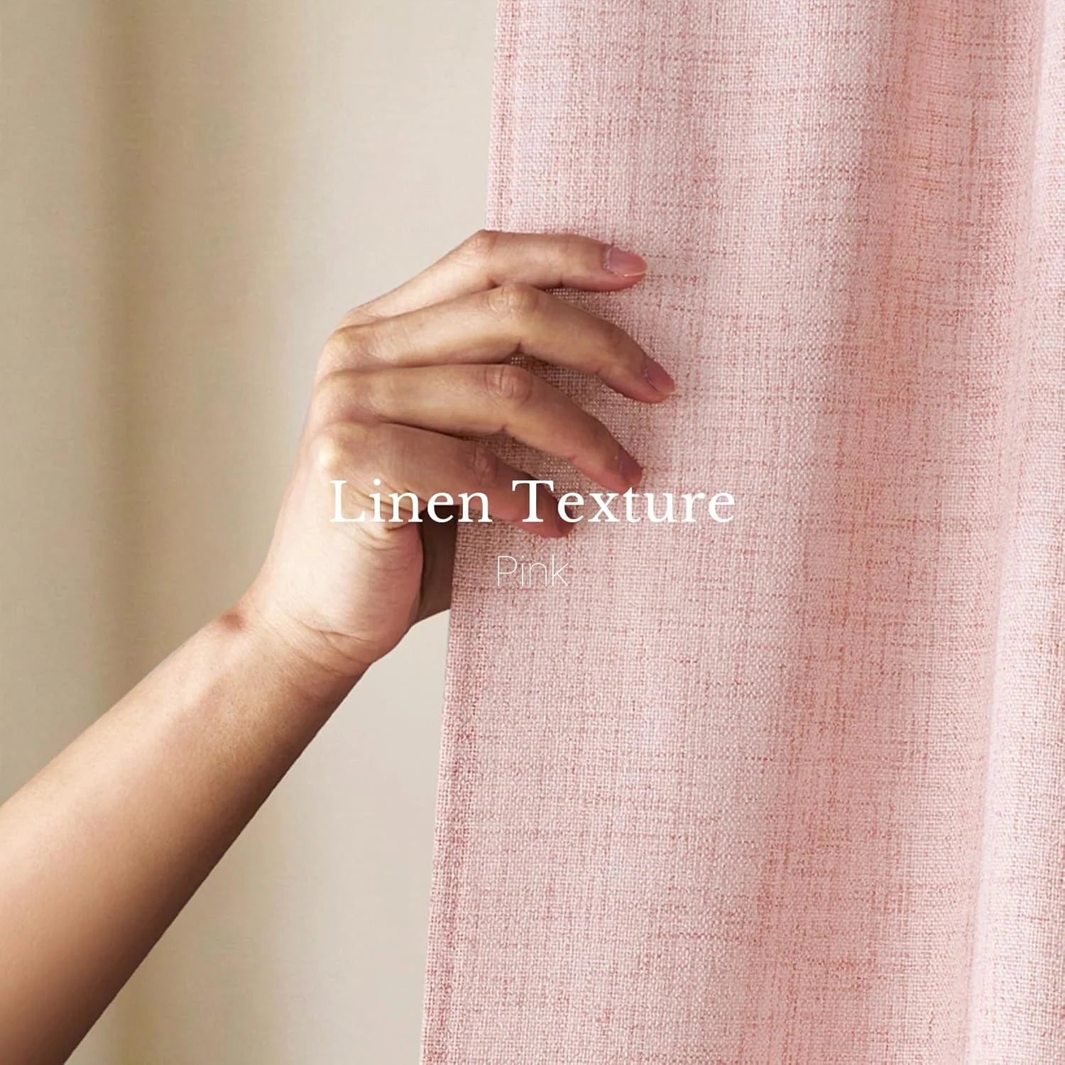 Close-up of a hand holding a soft pink linen-textured curtain, showcasing its woven detail.