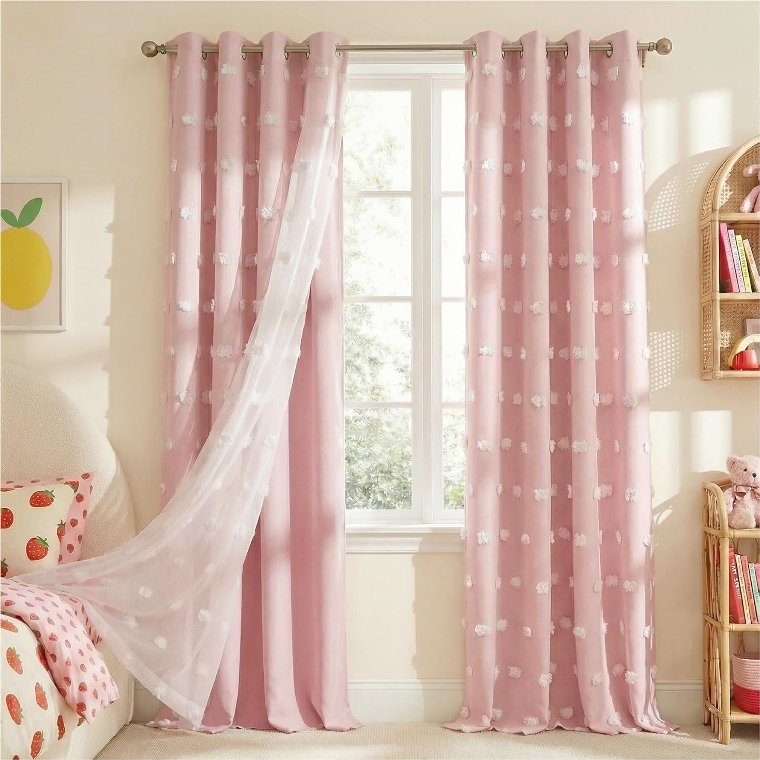 Pink grommet curtains with white pom-pom texture and sheer white tufted overlay in a child's bedroom.