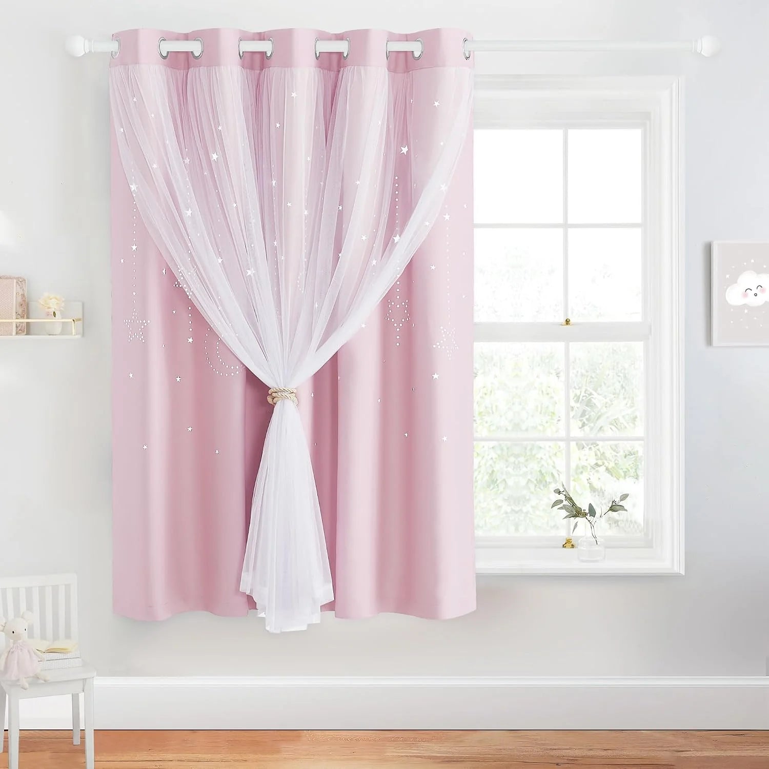 Pink kids curtain with white sheer overlay, silver grommets, and star pattern