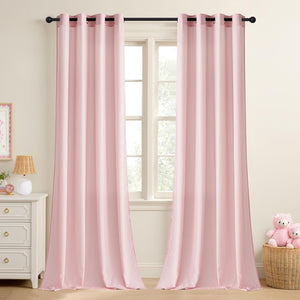 A pair of light pink solid curtains with dark metal grommet tops on a black rod in a window.
