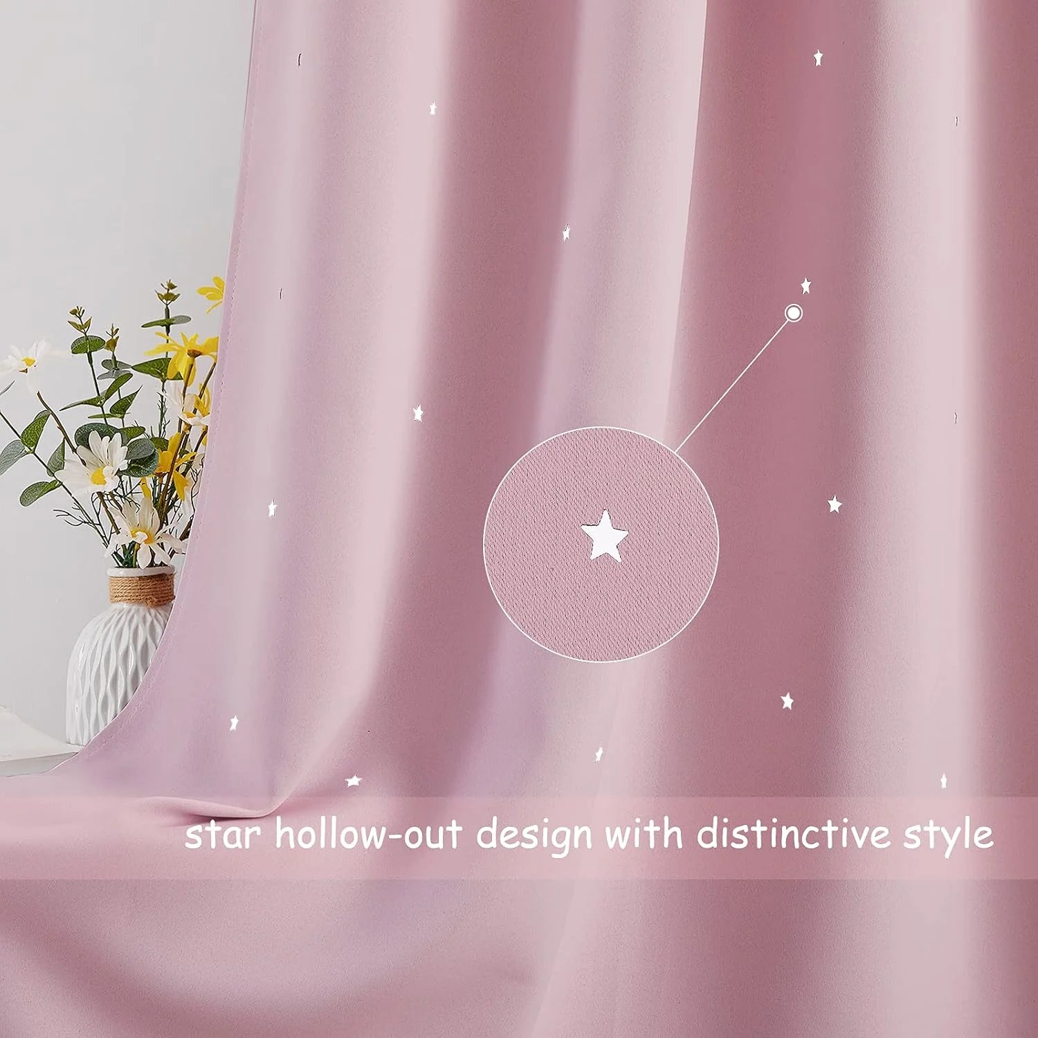 Pink curtain panel with tiny star cutout pattern and soft draped fabric texture