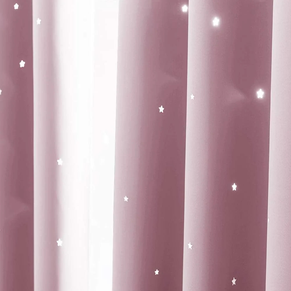 Dusty pink blackout curtain panel with small white star cutout pattern