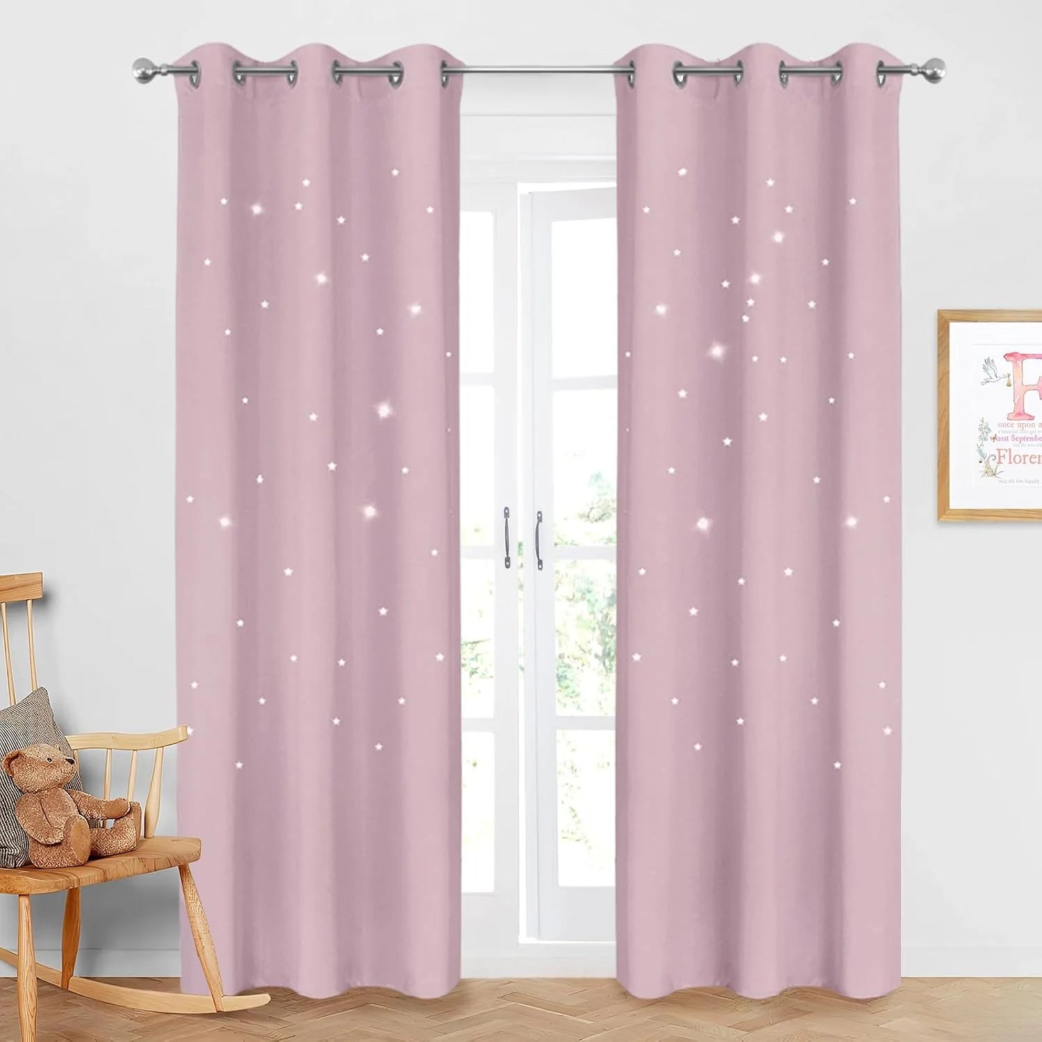 Pink star cutout curtains with grommet top hanging in a bright kids bedroom