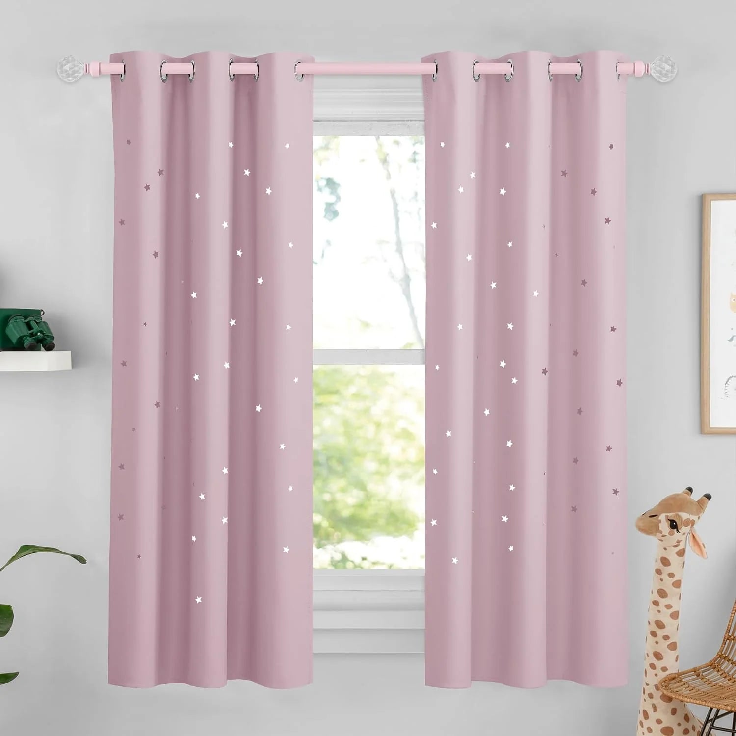 Soft pink kids curtains with silver grommets and scattered star pattern