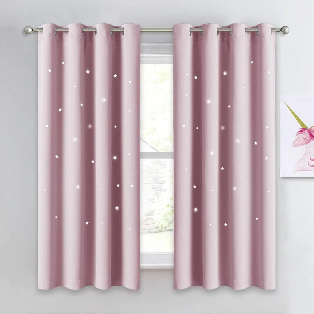 Blush pink grommet curtains with white star pattern hanging on a silver rod