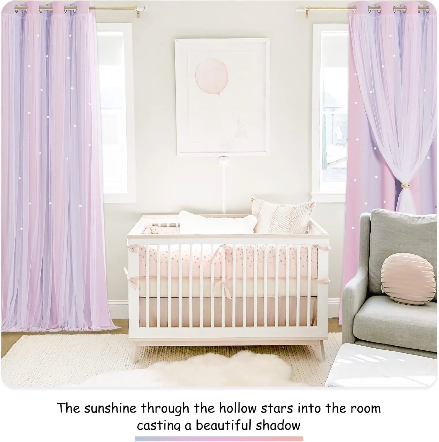 Pink sheer star curtains framing a white crib in a soft pastel nursery