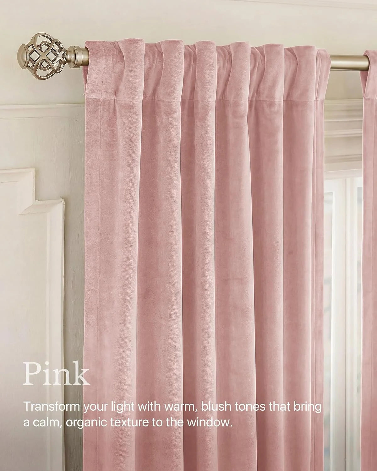 Soft pink velvet curtains with rod pocket pleats on a brushed gold curtain rod