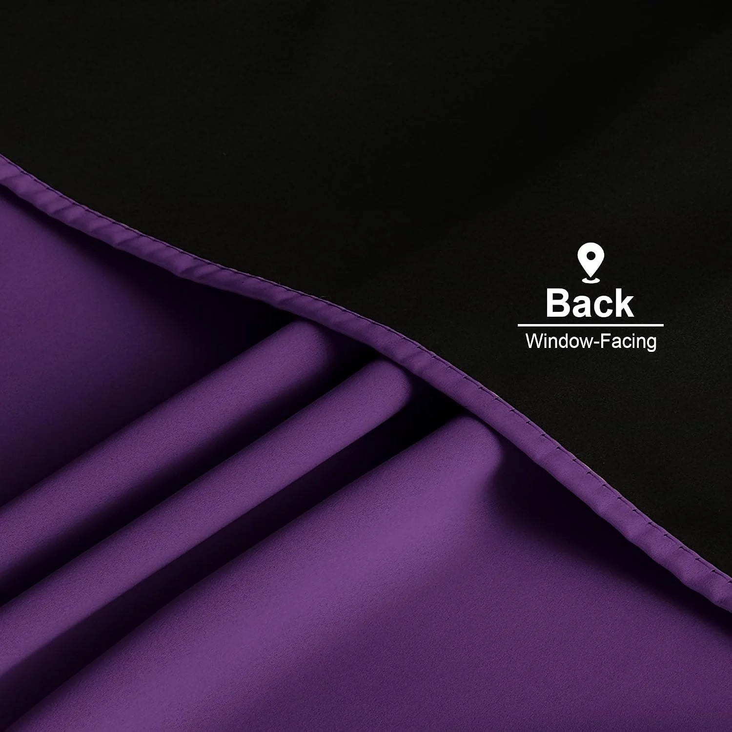 Close-up of purple blackout curtain back fabric with stitched hem and pleats