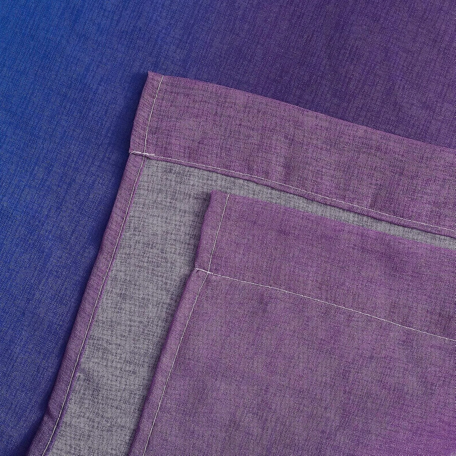 Close-up of purple sheer curtain fabric with stitched hem and layered panels
