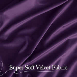 Close-up of luxurious dark purple super soft velvet fabric with elegant drapes and folds.