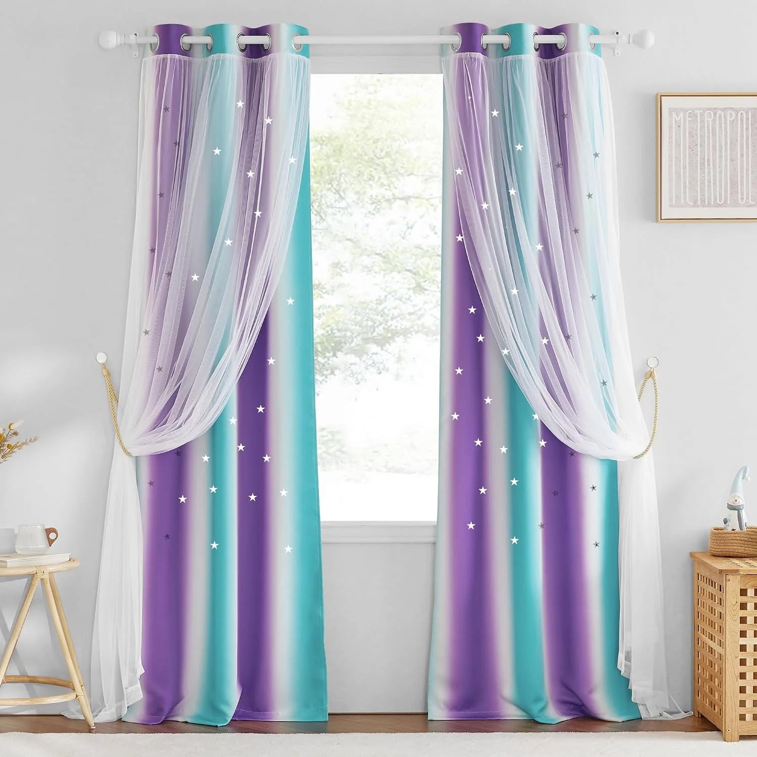 Purple and teal star-print curtains with white sheer overlay in a kids bedroom