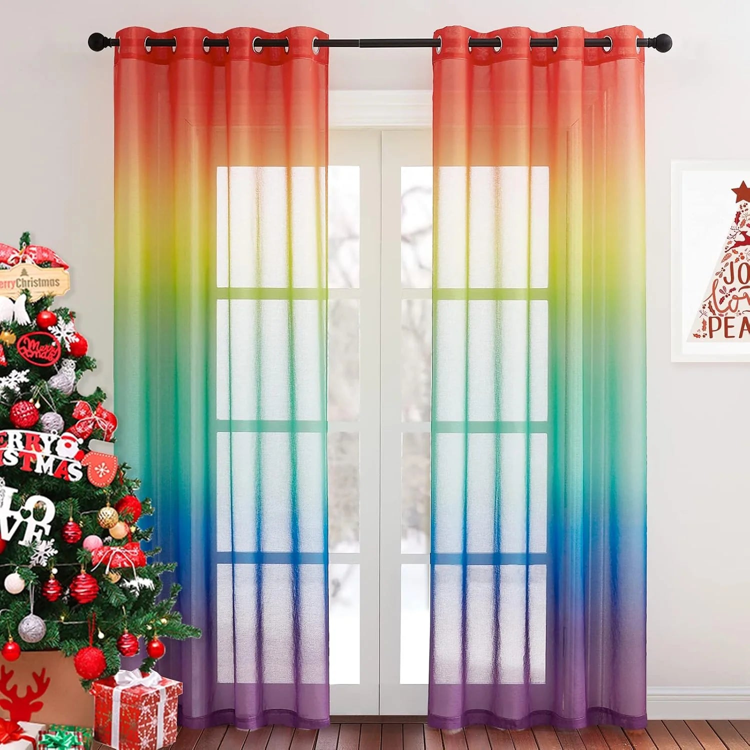 Rainbow ombre sheer curtains with grommet top hanging over white French doors