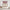 Red and cream buffalo check rod pocket valance with gathered top above kitchen window.