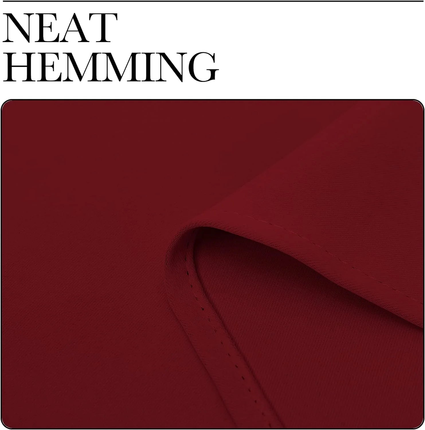 Close-up of red curtain fabric with a neatly hemmed edge and folded corner