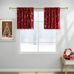 Two red valance curtains with shimmering gold Christmas trees, snowflakes, and bells hanging on a gold rod.