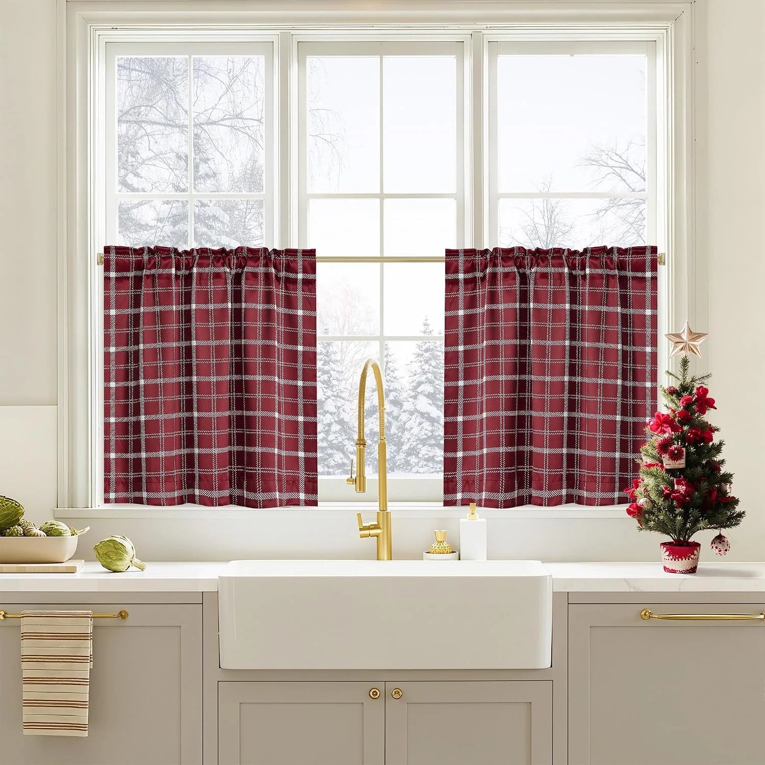 Red plaid cafe curtains on a white kitchen window above a farmhouse sink