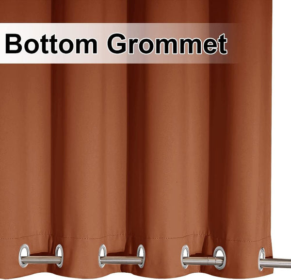 Close-up of a rust brown curtain panel featuring shiny silver metal grommets along the bottom edge.