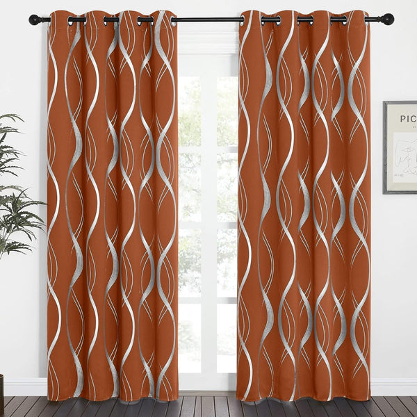 Pair of rust orange curtains with metallic silver wavy pattern and grommet top, enhancing a modern window.