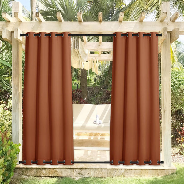 Rust outdoor privacy curtains with black grommets on wooden pergola. Bottom rod visible.