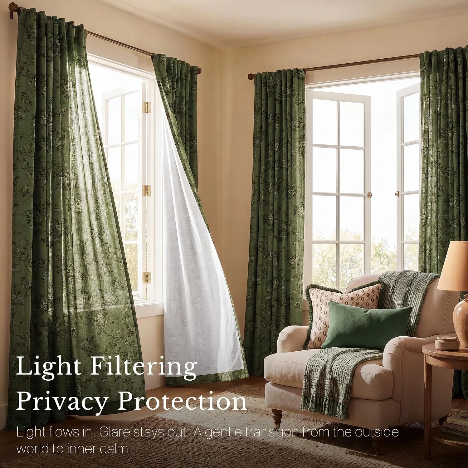 Sage green floral light-filtering curtains in a cozy living room with armchair