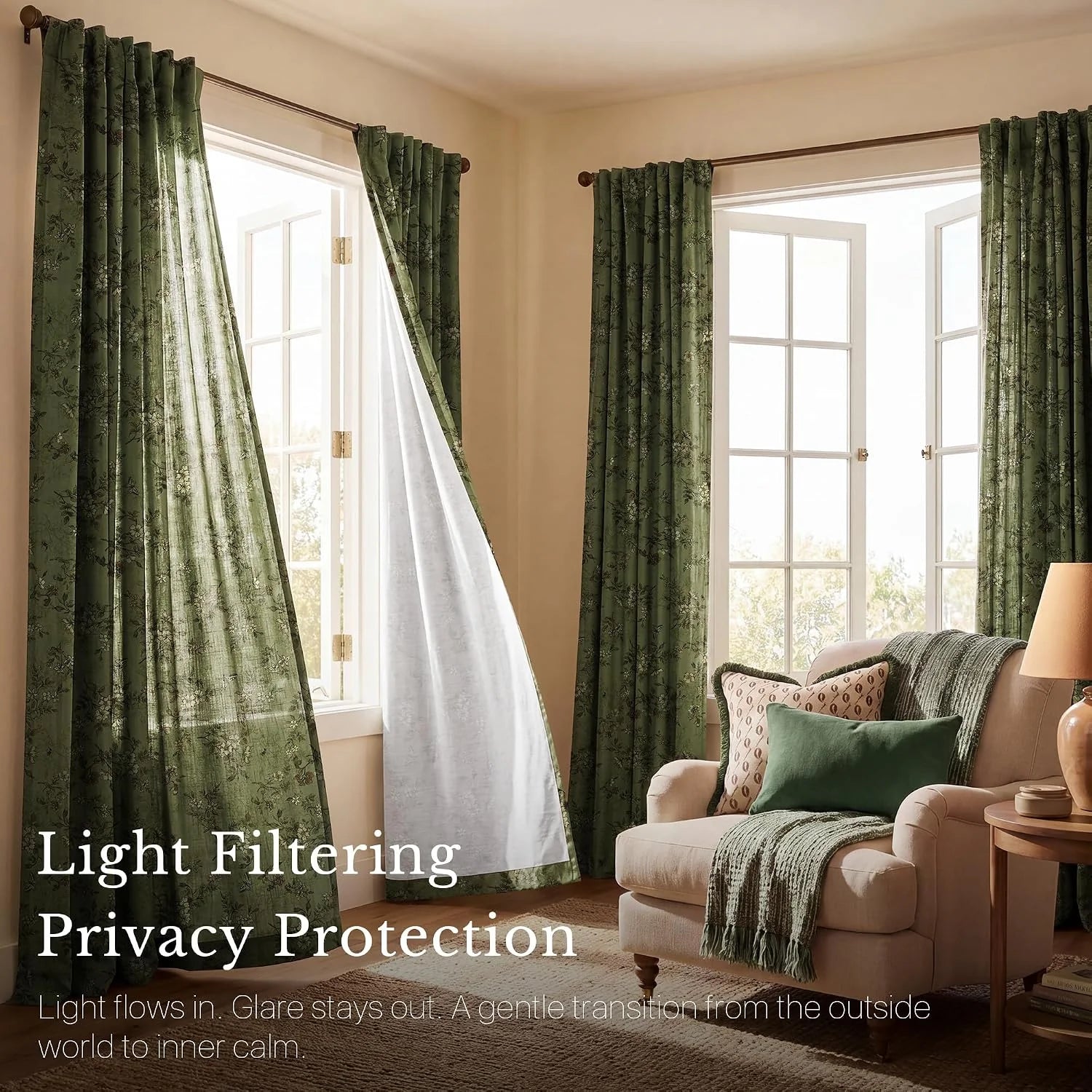Sage green floral light-filtering curtains in a cozy living room with armchair