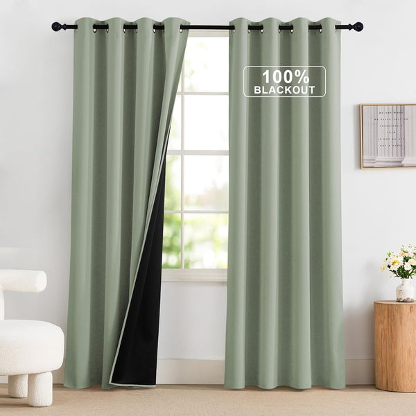 Sage green 100% blackout curtains with grommet top, showing black thermal lining.