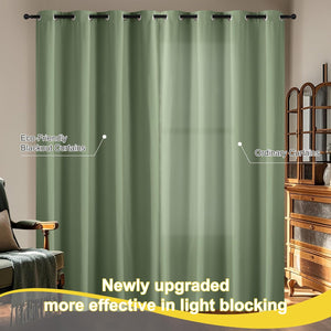 Two sage green blackout curtains with metal grommets on a rod, effectively blocking light in a room.
