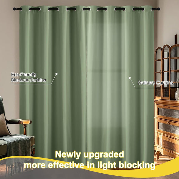 Two sage green blackout curtains with metal grommets on a rod, effectively blocking light in a room.