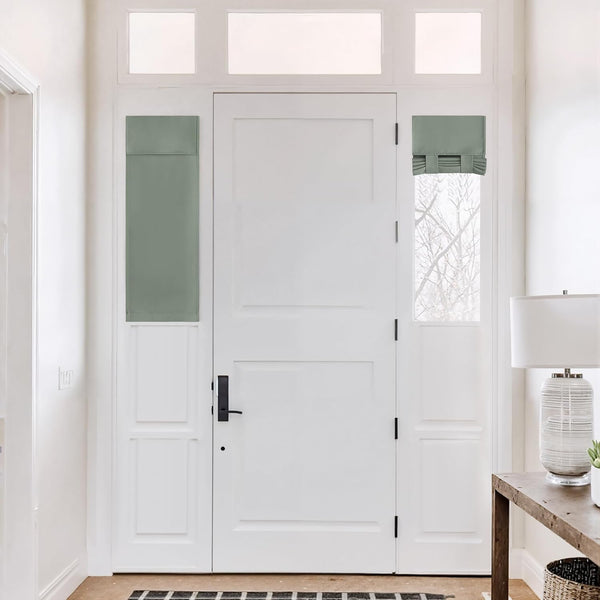 Sage green roman shade on right sidelight and matching privacy panel on left, flanking white entryway door.