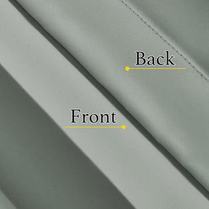 Close-up of sage green fabric, showcasing its smooth front surface and neatly stitched reverse side.