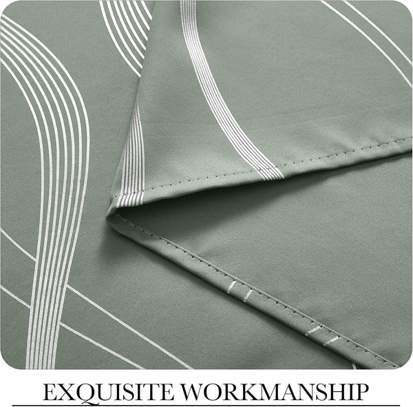 Detailed view of sage green curtain fabric with white geometric art deco pattern and precise stitching along the hem.