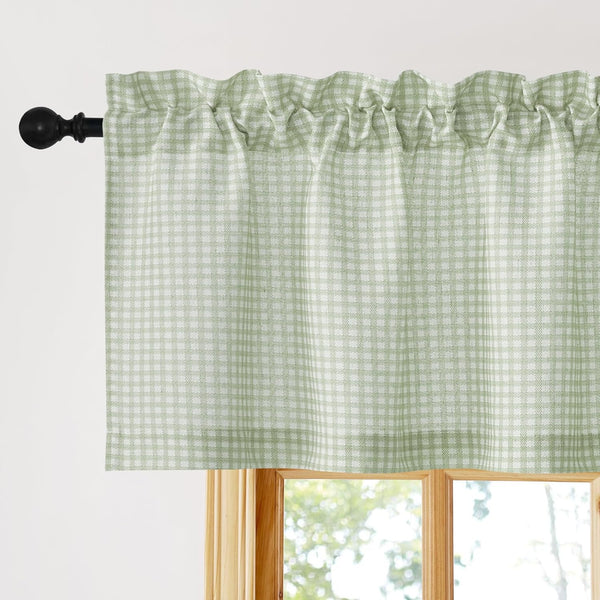 Sage green and white gingham check valance, gathered on black rod pocket over a wooden window.