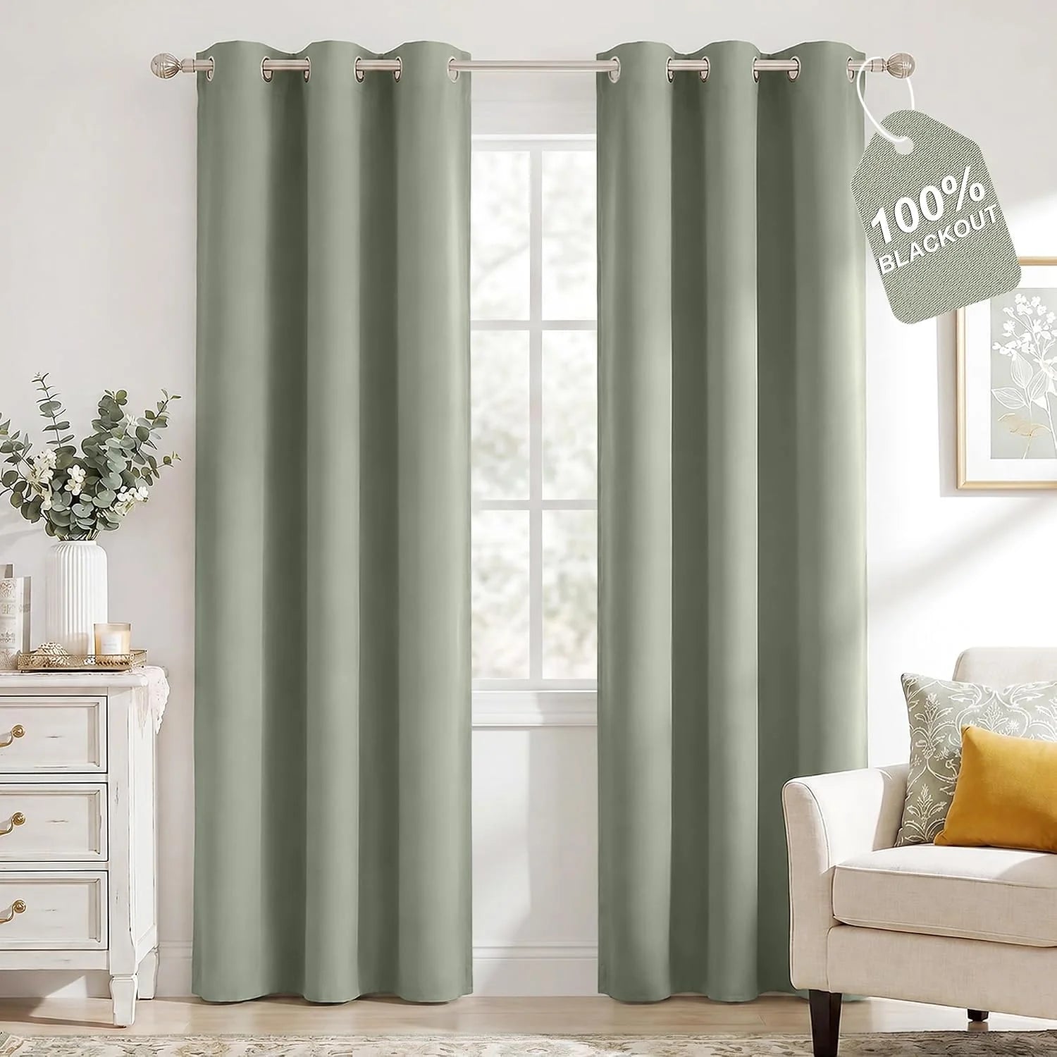 Sage green grommet top 100% blackout curtains in a bright living room.