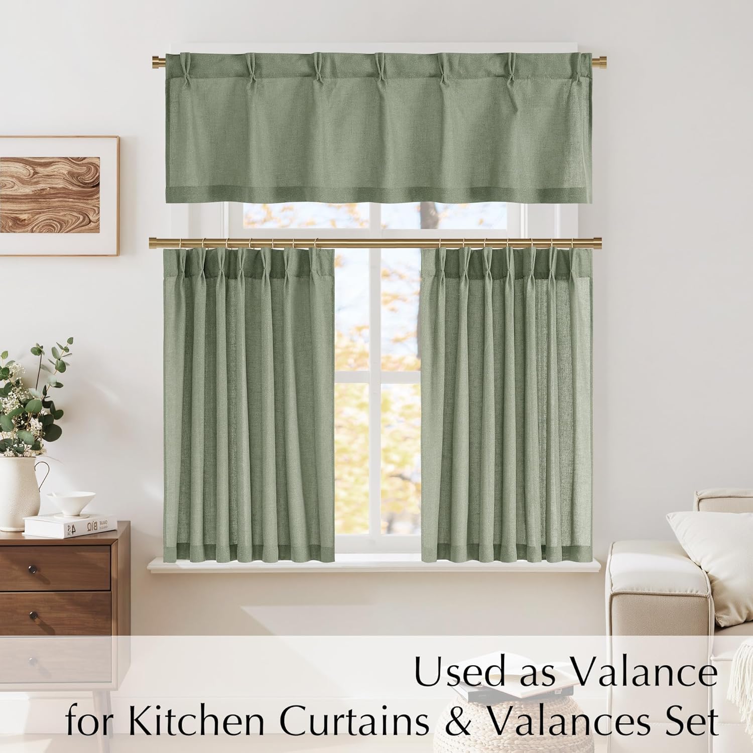 Sage green linen-textured valance and tier cafe curtains on gold rods, showing a semi-sheer weave.