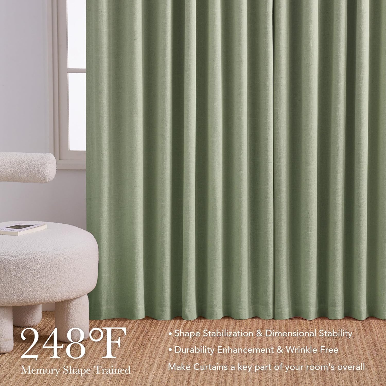 Floor-length sage green textured curtains with memory shape pleats next to a window and white ottoman.