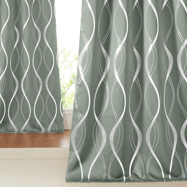 Modern sage green window curtains with a shimmering silver metallic wavy line pattern.
