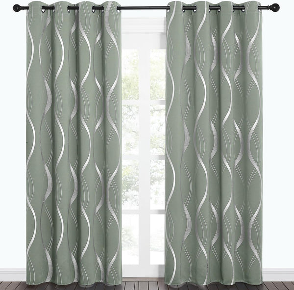 Sage green curtains with metallic silver wavy pattern and grommet tops hanging on a black rod.