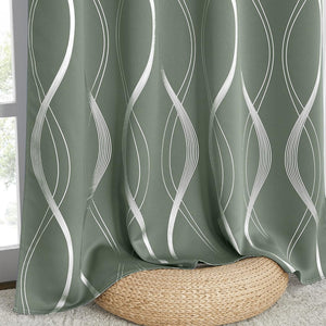 Sage green blackout curtains feature a modern silver wavy line pattern.
