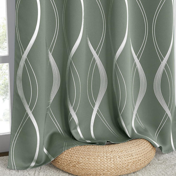 Sage green blackout curtains feature a modern silver wavy line pattern.