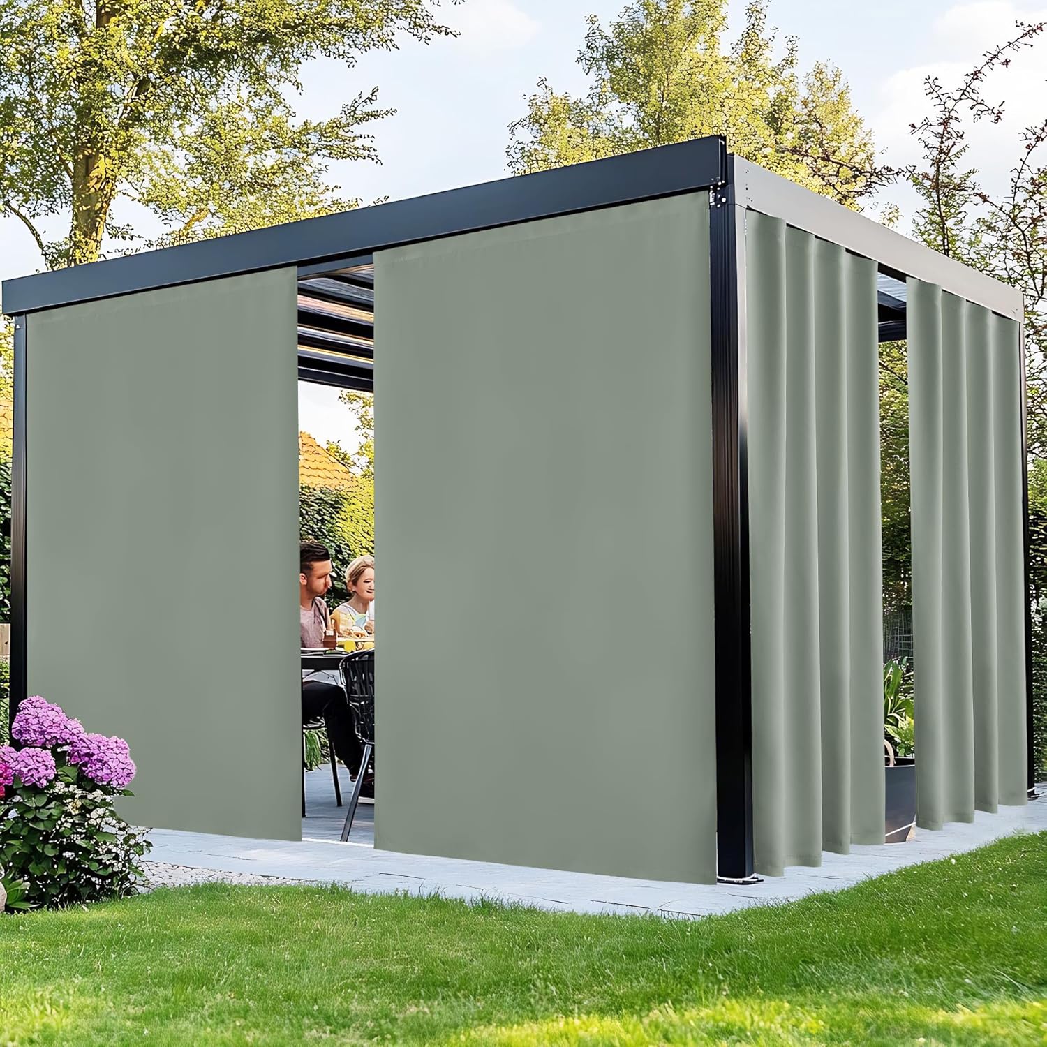 Sage green sliding privacy screens on modern black pergola, offering shade for a couple on patio.