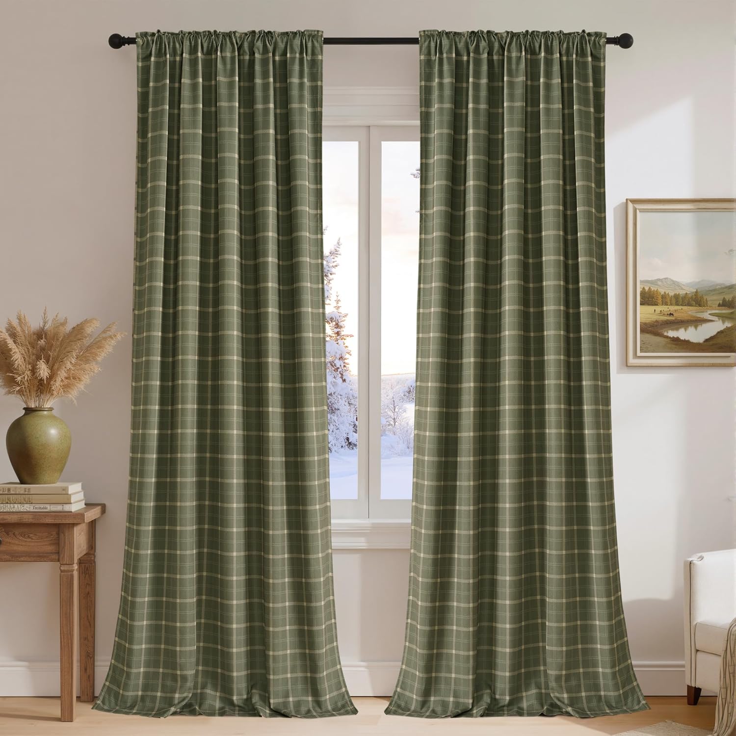 Sage green plaid rod pocket curtains with thin beige lines, hung on a black rod in a cozy room.
