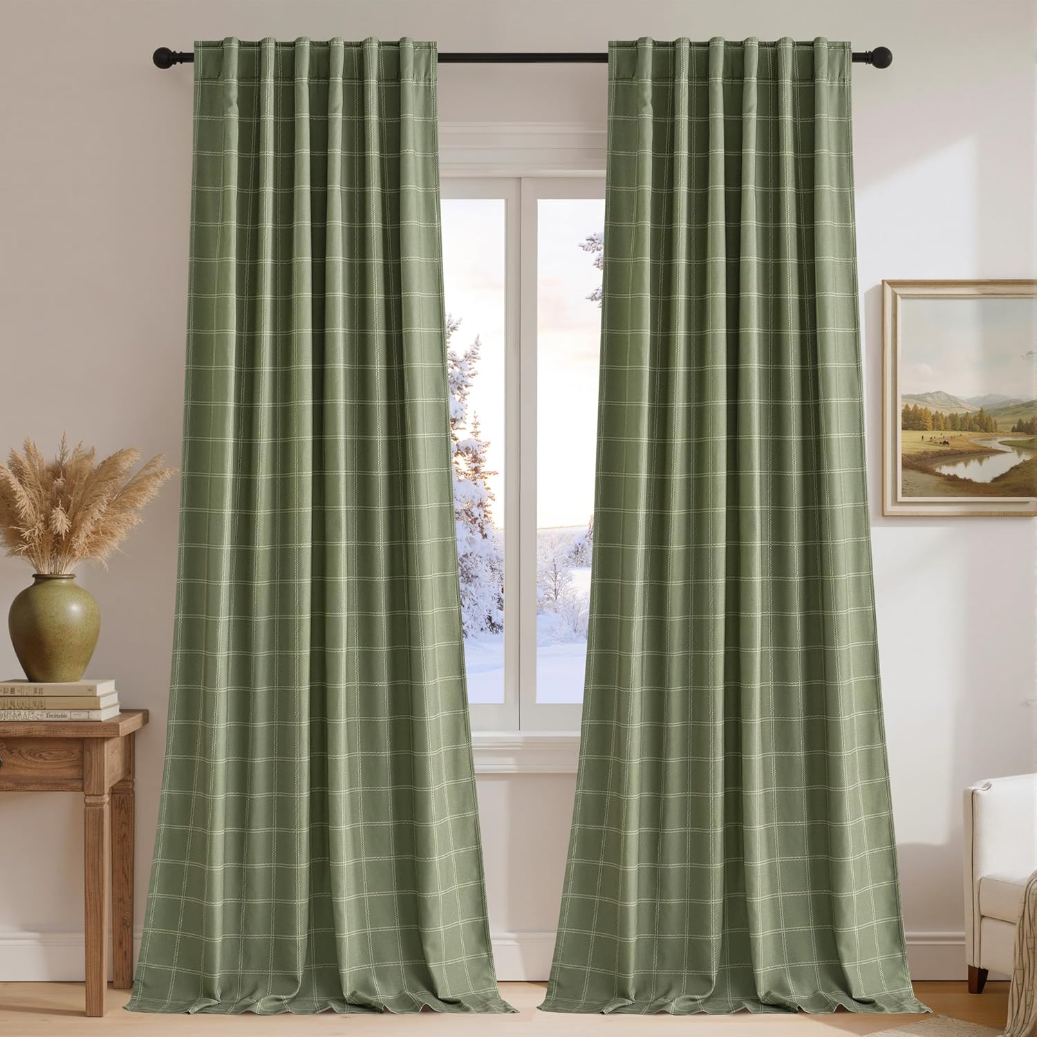 Sage green plaid window curtain panels with a rod pocket top and soft pleats, hung on a black rod.
