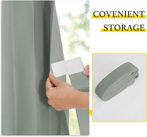 Hand fastening white velcro strap on pleated sage green window blind. Rolled for convenient storage.